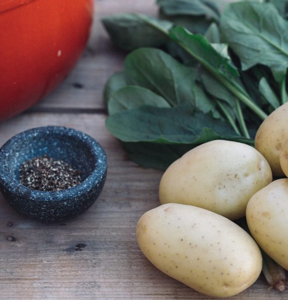 Fresh WA potatoes and spinach highlighting the dietary fibre in potatoes